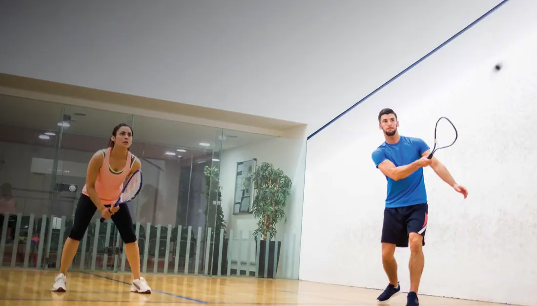 Squash court with two players